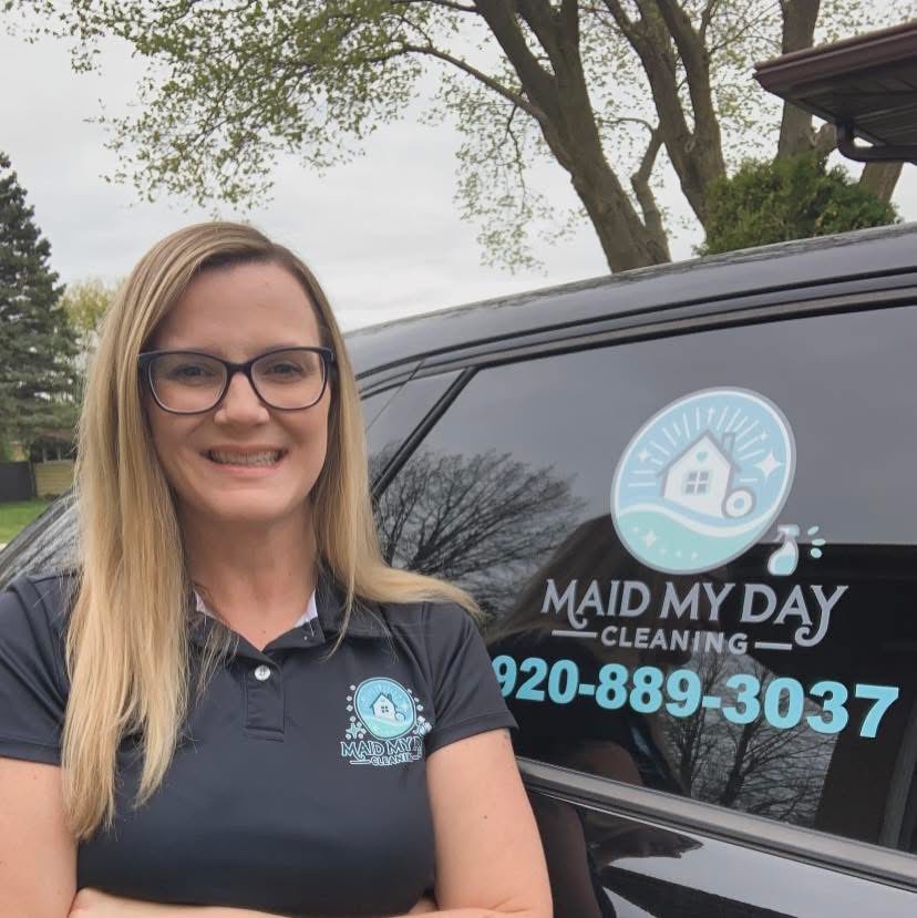 Patrisha Ryan beside her Maid My Day Cleaning branded vehicle